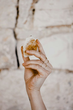 person holding bread with cheese