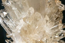 clear crystal stone on black surface