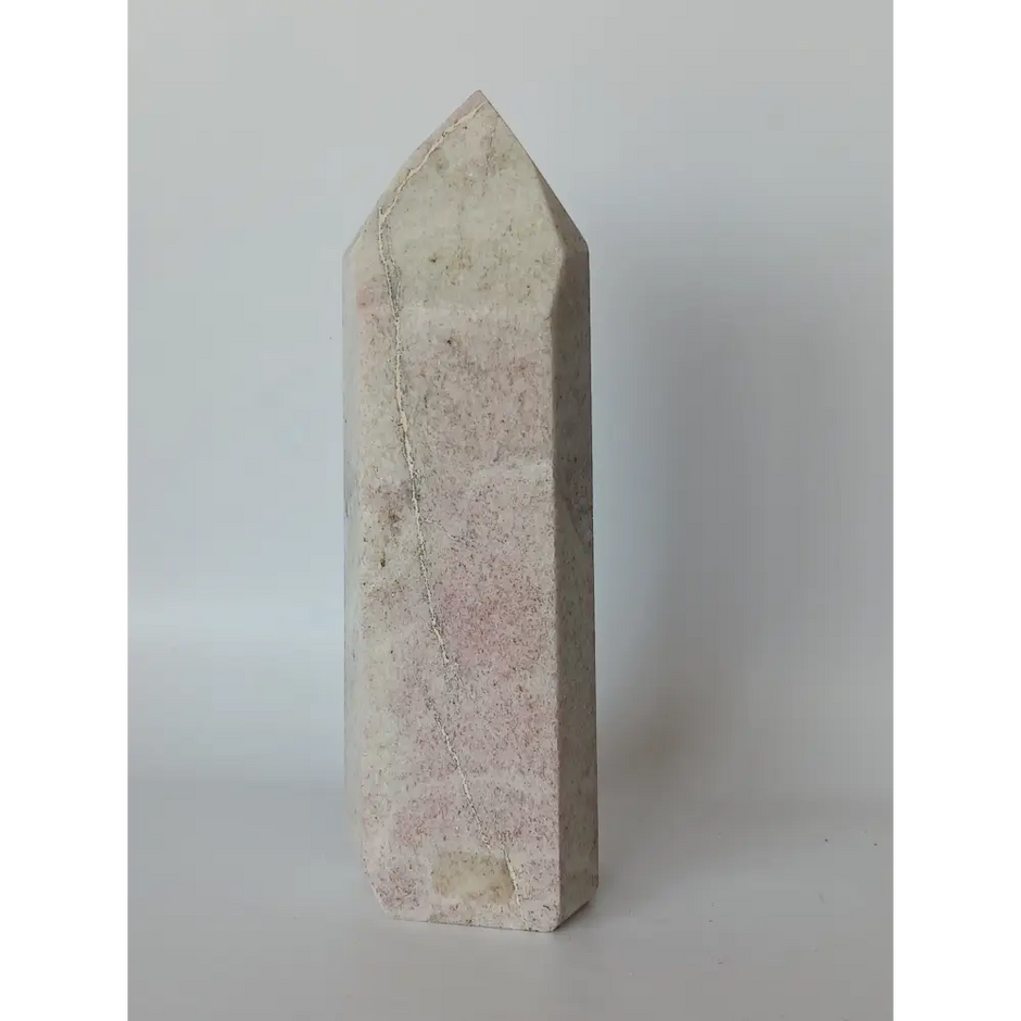Hand-carved Albite Mica tower featuring radiant white albite with shimmering mica inclusions, displayed on a white background.
