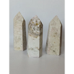 Hand-carved Albite Mica tower featuring radiant white albite with shimmering mica inclusions, displayed on a white background.