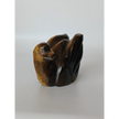 Assorted hand-carved animal figurines made from Blue Tiger’s Eye, Fluorite, and Tiger’s Eye crystals, each featuring unique colors and patterns, displayed on a white background.
