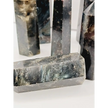 Astrophyllite (firework stone) with garnet tower, 2.5–3 inches, hand-polished with golden flashes and deep red inclusions, displayed on a white background.