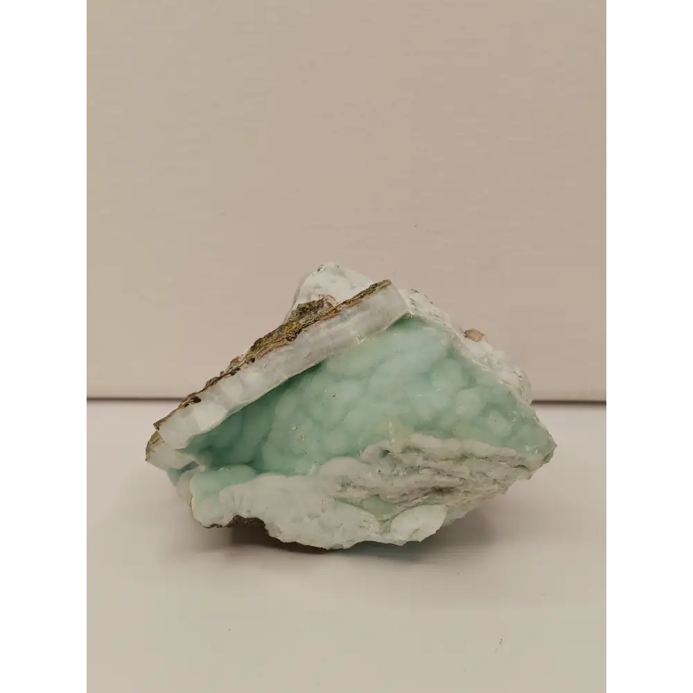 Natural Blue Aragonite specimen with tranquil blue hues and unique formations, displayed on a white background.