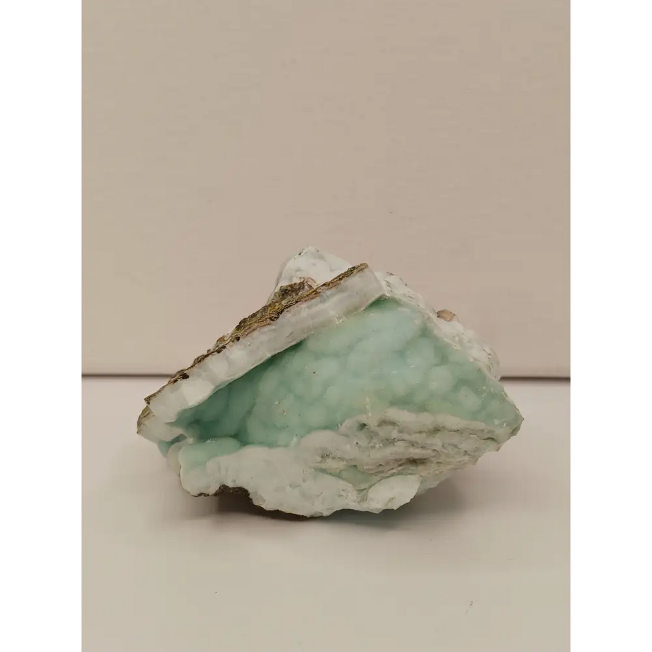 Natural Blue Aragonite specimen with tranquil blue hues and unique formations, displayed on a white background.