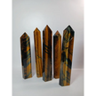 Hand-carved Blue Tigers Eye (Hawk’s Eye) tower with shimmering blue and gold bands, displayed on a white background.