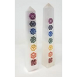 Hand-carved selenite obelisk with vibrant chakra stones arranged vertically, displayed on a white background. Perfect for cleansing, chakra alignment, and high-vibrational energy.