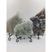 Fine glittery amethyst specimen, featuring sparkling purple points and a shimmering surface, displayed on a white background.