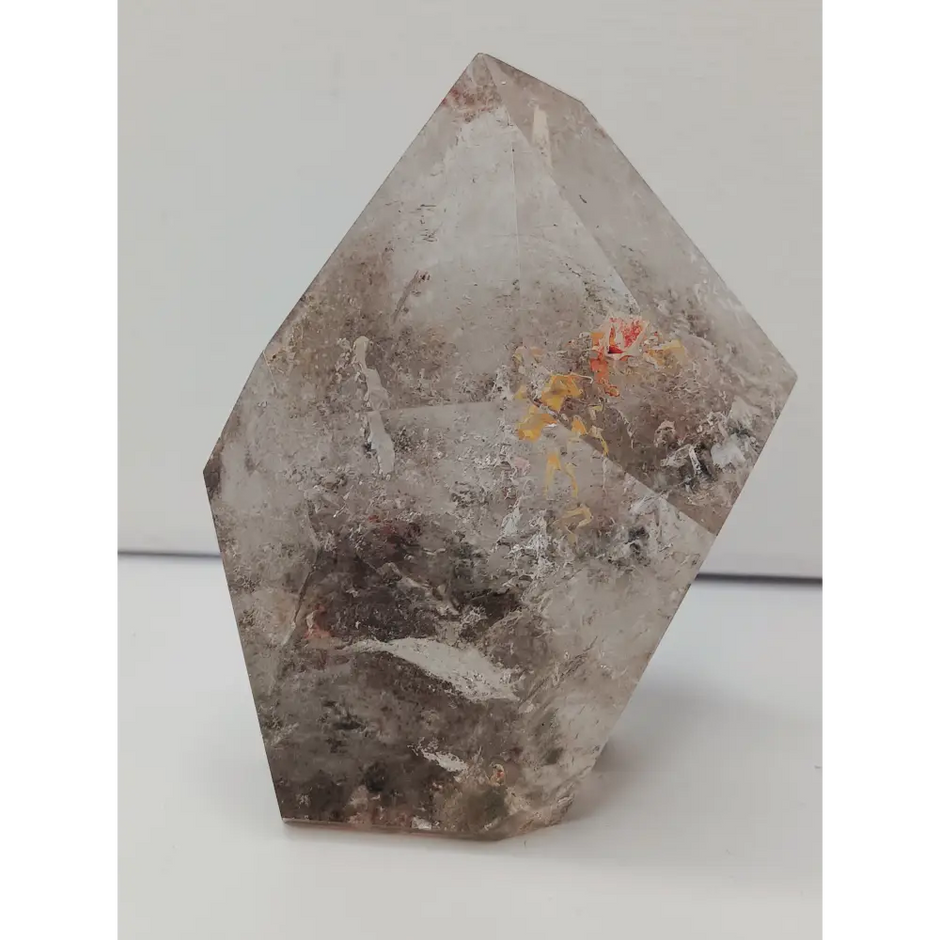 Hexagonal stone with natural patterns on a white background