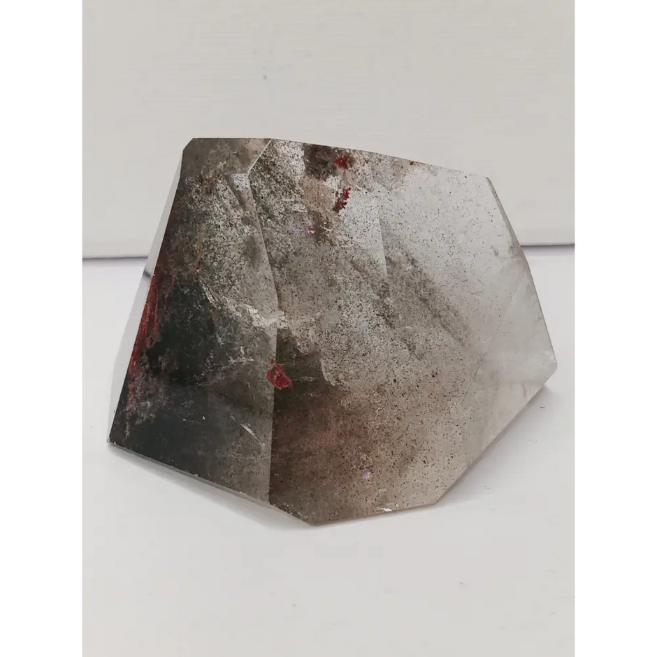 Hexagonal stone with a rough texture on a white background