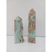 Hand-carved Gemy Hemimorphite tower with sparkling blue hues, displayed on a white background.
