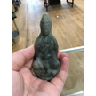Hand-carved Goddess Guanyin statue made from genuine labradorite, featuring iridescent flashes of blue, green, and gold, displayed upright on a white background.