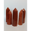 Hand-carved Goldstone tower featuring glittering copper sparkles and a glossy golden-brown finish, displayed on a white background.