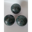 Hand-polished Green Mica sphere featuring sparkling, leafy-green hues and a glossy finish, displayed on a white background.
