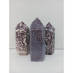 Hand-carved Lepidolite tower with soft lavender hues and natural shimmer, displayed on a white background.
