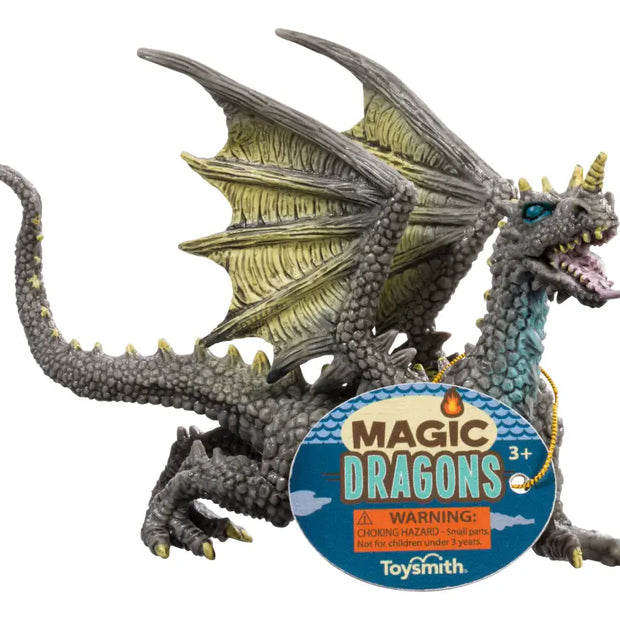Toy dragon figure with 'Magic Dragons' label and Toysmith branding on a white background