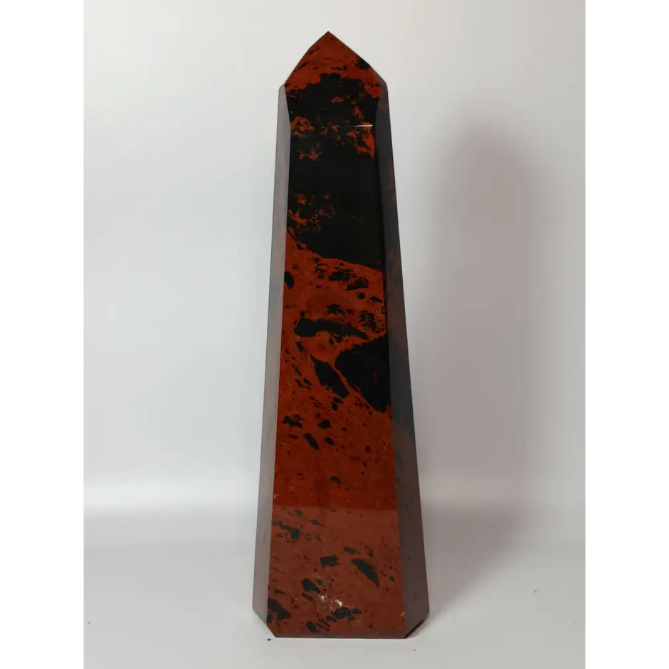 Hand-carved Mahogany Obsidian tower with rich brown and black swirls, displayed on a white background.