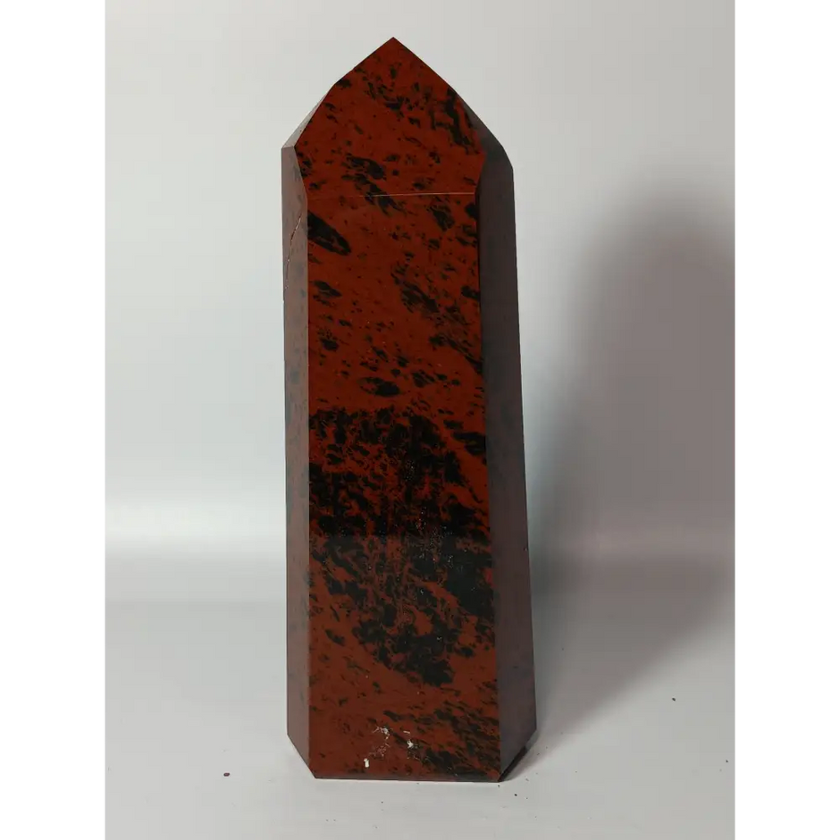 Hand-carved Mahogany Obsidian tower with rich brown and black swirls, displayed on a white background.
