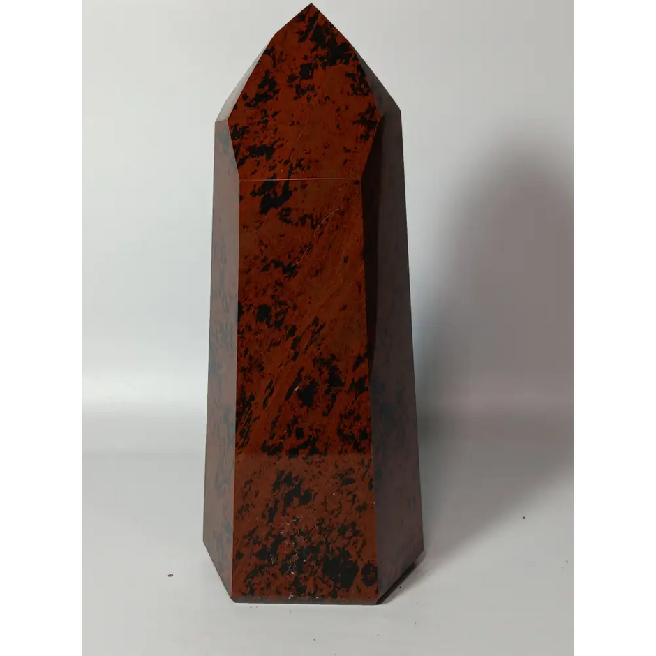 Hand-carved Mahogany Obsidian tower with rich brown and black swirls, displayed on a white background.