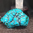 Malachite and chrysocolla specimen with vibrant green bands and blue-teal hues, displayed on a white background. Perfect for transformation, heart healing, and inner wisdom.