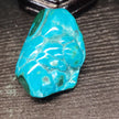 Malachite and chrysocolla specimen with vibrant green bands and blue-teal hues, displayed on a white background. Perfect for transformation, heart healing, and inner wisdom.