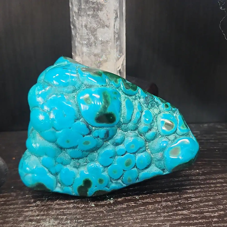 Malachite and chrysocolla specimen with vibrant green bands and blue-teal hues, displayed on a white background. Perfect for transformation, heart healing, and inner wisdom.