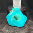 Malachite and chrysocolla specimen with vibrant green bands and blue-teal hues, displayed on a white background. Perfect for transformation, heart healing, and inner wisdom.