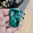 Hand-selected malachite specimen with vibrant green bands and natural patterns, displayed on a white background. Perfect for transformation, protection, and heart chakra healing.