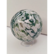 Moss Agate sphere with deep green swirls and sparkling druzy pocket, displayed on a white background.