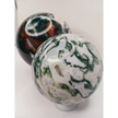 Moss Agate sphere with deep green swirls and sparkling druzy pocket, displayed on a white background.