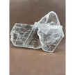 Pink selenite slab, polished with soft rosy hues, displayed on a white background.