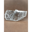 Pink selenite slab, polished with soft rosy hues, displayed on a white background.
