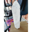 Diamantina clear quartz tower, 17 inches tall, polished with exceptional clarity and natural inclusions, displayed on a white background.