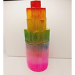 Rainbow selenite tiered tower, polished with a vibrant rainbow sheen and step-like design, displayed on a white background.