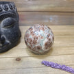 Hand-polished RARE Green Sakura Flower Agate featuring lush green tones and delicate, flower-like patterns reminiscent of cherry blossoms, displayed on a white background.