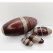 Shiva Lingam stones, polished with natural earthy patterns, available in sizes 1