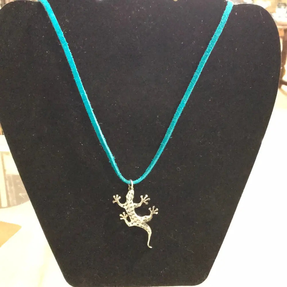 Sterling silver lizard pendant with intricate detailing, displayed on a white background. Perfect for transformation, adaptability, and ancient wisdom.